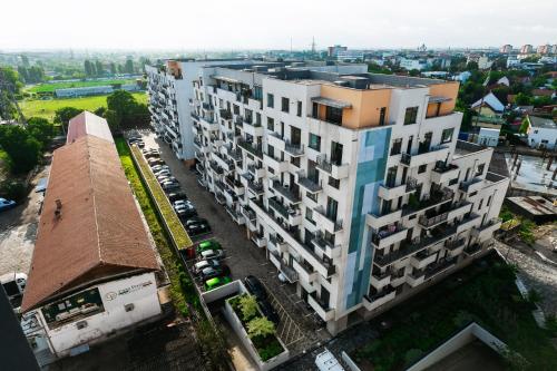 an overhead view of a tall building with a parking lot at EVRA APARTMENTS Royal 2 in Timişoara