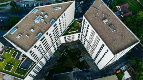 an overhead view of a large white building at EVRA APARTMENTS Royal 2 in Timişoara