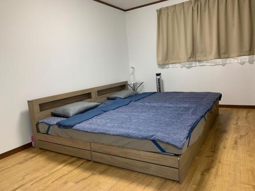 a bedroom with a large bed in a white room at weiwei - Vacation STAY 08698v in Wakayama