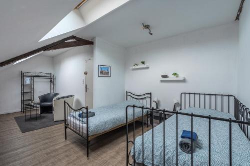Postel nebo postele na pokoji v ubytování Douai house