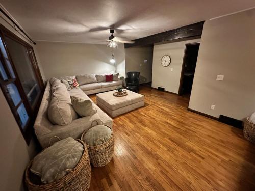 a living room with a couch and a table at Cozy on Campus in Lawrence