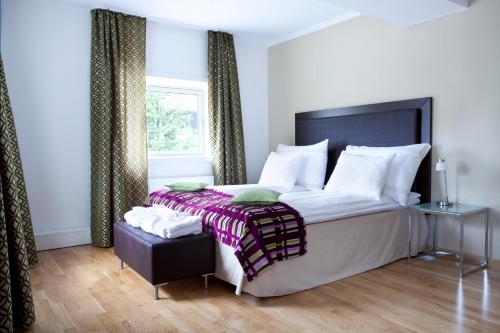 Katil atau katil-katil dalam bilik di Quality Hotel Augustin