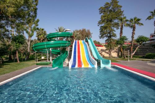 a water slide in a pool at a resort at Megasaray Resort Side in Side