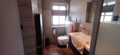 Ένα μπάνιο στο Bed & Breakfast Appenseweg