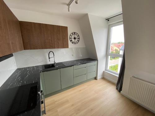 Η κουζίνα ή μικρή κουζίνα στο Apartament Zielony Widok