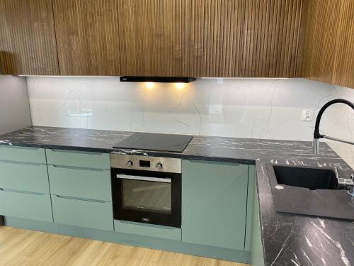 Η κουζίνα ή μικρή κουζίνα στο Apartament Zielony Widok