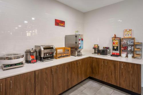 a kitchen with a counter top with appliances on it at Best Western Plus Columbia Inn in Columbia