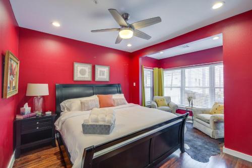 a red bedroom with a bed and a ceiling fan at Pet-Friendly Houston Apartment 1 Mi to Downtown! in Houston