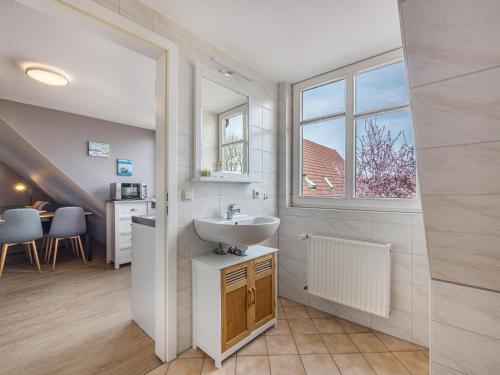 a bathroom with a sink and a window at Studio in Buchholz am Müritzsee in Buchholz