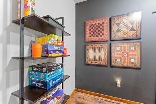 a book shelf with books on it in a room at 6BD 6BT New Clubhouse indoor pool 1 min to SDC in Branson
