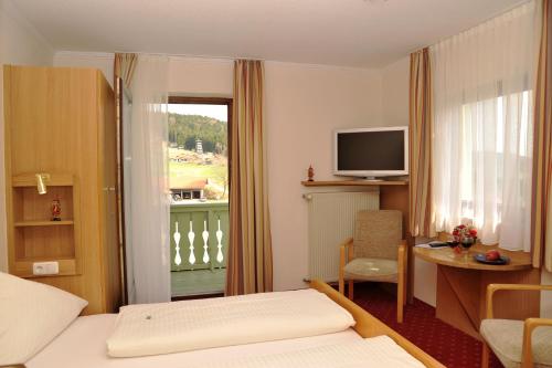 Кровать или кровати в номере Gasthof Reiner