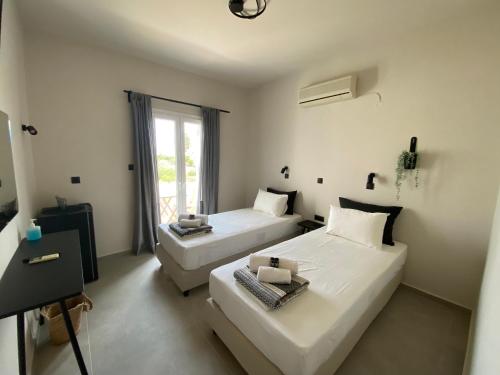 Postel nebo postele na pokoji v ubytování Mellow Paros