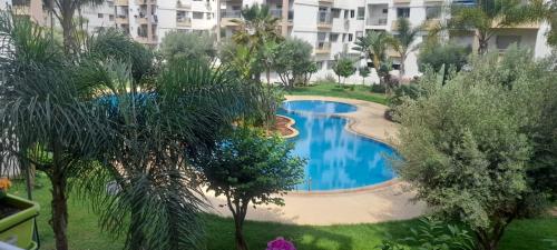 an overhead view of a swimming pool in a resort at Galia Mohammedia residence POOL WIFI in Mohammedia