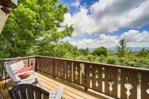 a deck with two chairs and a view of the mountains at 1 Mi to Beech Mtn Ski Resort Home with Large Yard in Beech Mountain
