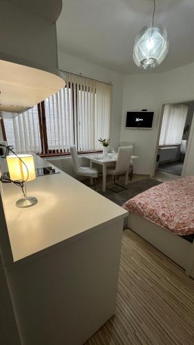 a hotel room with a bed and a living room at Two bedroom flat - Hyper Center Brussels in Brussels
