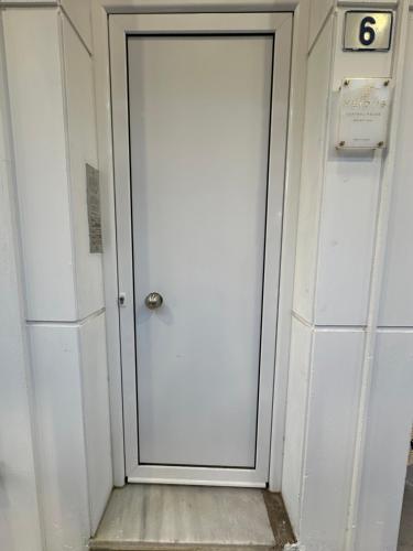 a door in a building with the number eight on it at The Heidi's Central House in Kos Town