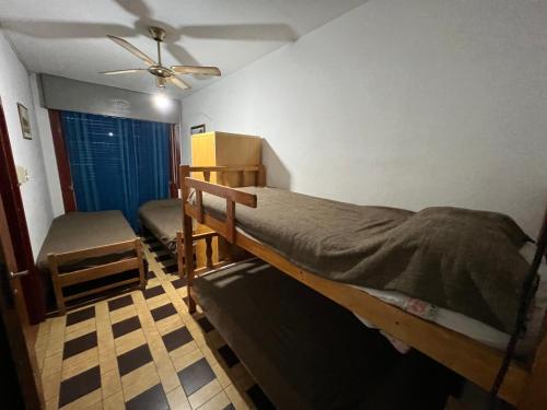 a bedroom with a bed and a ceiling fan at Cybeles Family Apart in Villa Carlos Paz