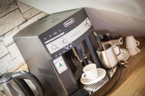 a coffee maker sitting on top of a counter at Ferienwohnungen Christina Erisgen in Olderup