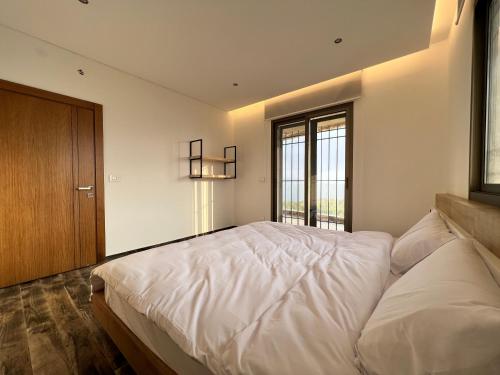 Ένα ή περισσότερα κρεβάτια σε δωμάτιο στο Casa Del Mela Villa