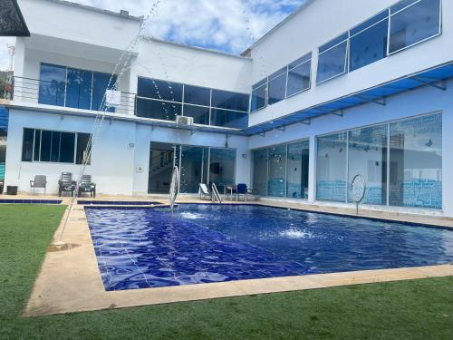 a house with a swimming pool in the yard at La Higuera, Casa Campestre. in El Asilo
