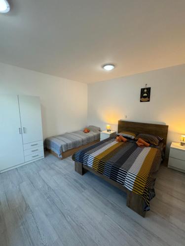 Postel nebo postele na pokoji v ubytování Apartman Laura