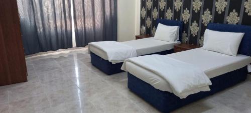 Ένα ή περισσότερα κρεβάτια σε δωμάτιο στο BABYLOON بابيلون