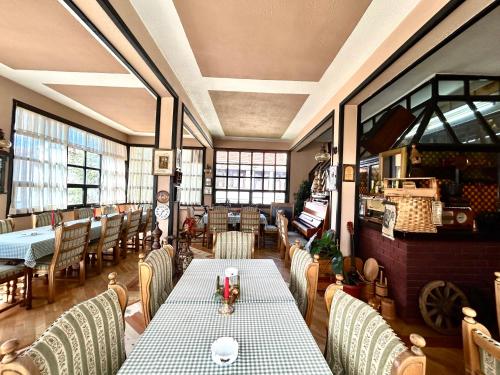 a dining room with a table and chairs at Hondo Rooms & Apartments in Sarajevo