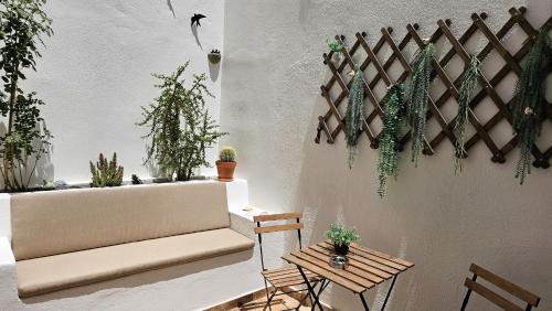 a room with potted plants on the wall at Casa da Mouraria in Faro