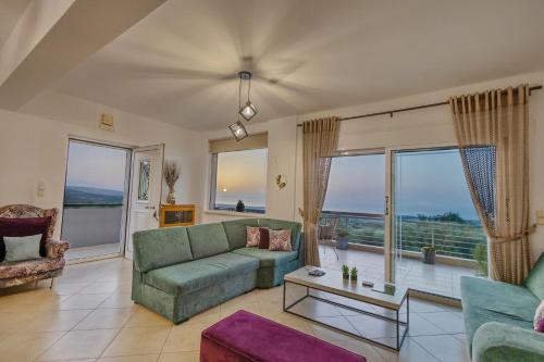 a living room with a couch and a table at Country House Crete in Amnátos