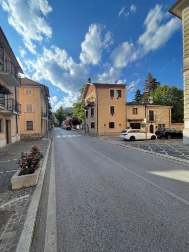 an empty street in a town with buildings at 18th Century Samnium Stone Residence in Alfedena