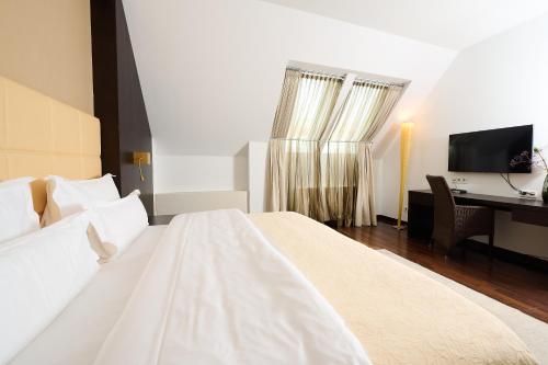 Cama o camas de una habitación en MyPlace Premium Apartments