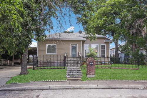 a house with a gate and a fence at 126 Lucas Street in San Antonio