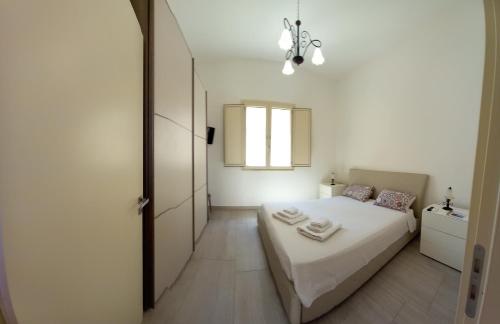 TORRE SUL MARE affittacamere Ugentoにあるベッド