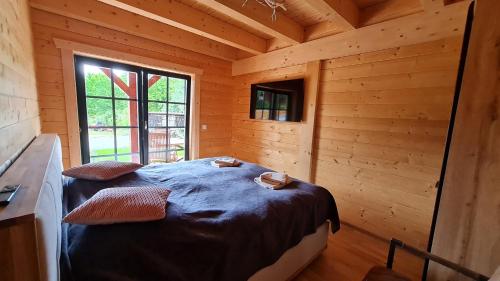 Ένα ή περισσότερα κρεβάτια σε δωμάτιο στο Blockhaus an der Dahme , Ferienhaus