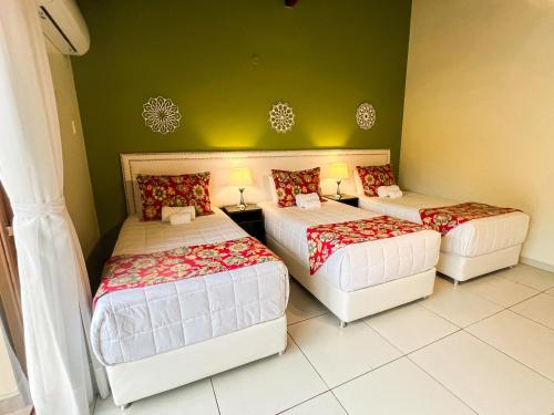 Un ou plusieurs lits dans un hébergement de l'établissement Mburucuyá Hotel Boutique