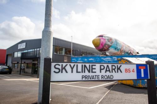a sign in a parking lot in front of a building at Boeing 727 Airliner Private Jet in Bristol