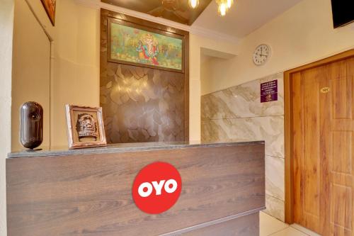a xo sign on a counter in a lobby at Hotel O IRA Comforts in Bengaluru