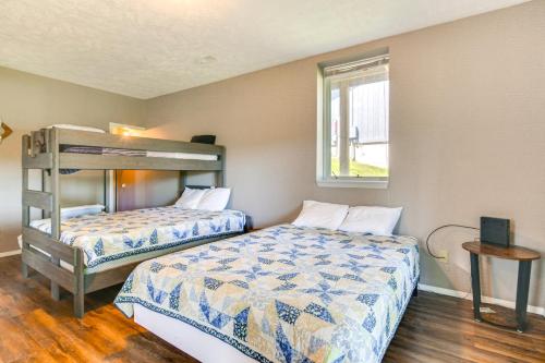 a bedroom with two beds and a bunk bed at Reeds Spring Retreat with Lakeview Deck and Grill in Reeds Spring