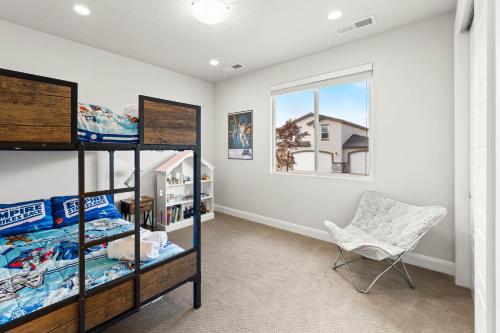 a bedroom with two bunk beds and a chair at Angels Landing3bed2ba Private Hot Tub in Washington