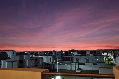 a view of the sunset from the balcony of a building at Excelente lugar para descansar in Emiliano Zapata