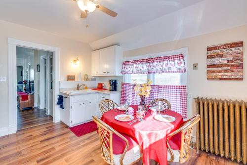 a dining room with a red table and chairs at Lake Michigan Vacation Rental 1 Block to Marina! in Manitowoc