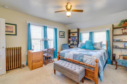 a bedroom with a bed and a desk and a chair at Lake Michigan Vacation Rental 1 Block to Marina! in Manitowoc