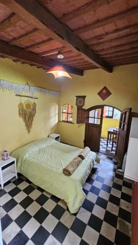 Ένα ή περισσότερα κρεβάτια σε δωμάτιο στο Hunab Ku Hostel