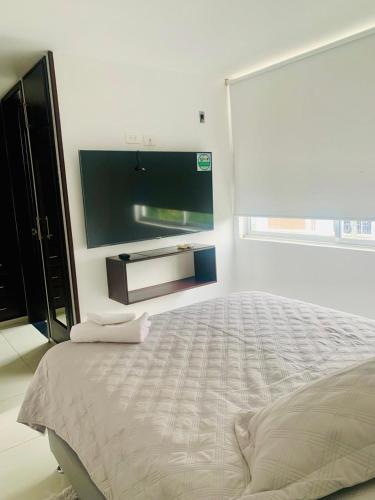 Ένα ή περισσότερα κρεβάτια σε δωμάτιο στο Apartamento Merecure