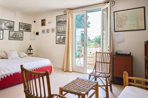 a bedroom with a bed and a sliding glass door at Tenuta Belvedere in Otranto