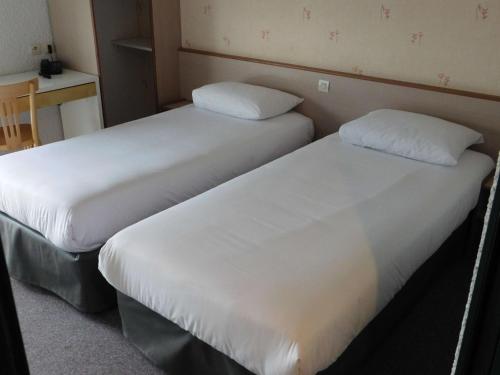 Postel nebo postele na pokoji v ubytování Brit Hotel Argentan