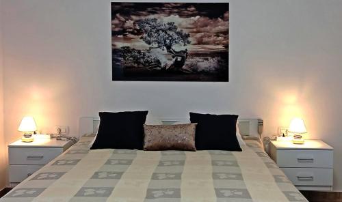 Ένα ή περισσότερα κρεβάτια σε δωμάτιο στο Mia apartman