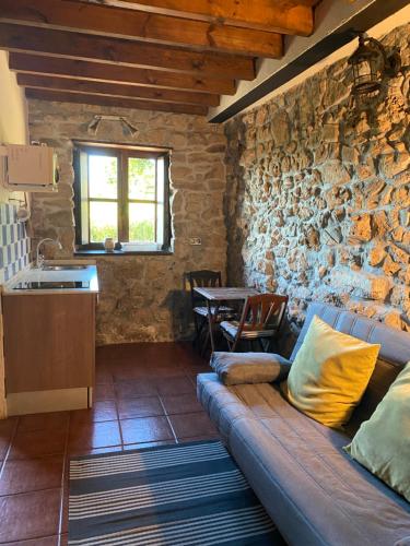 a living room with a couch and a table at La Fontanina de Mario in Villaviciosa