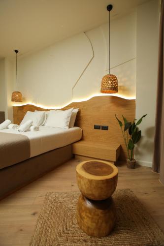 a bedroom with a bed and a wooden bowl on a table at Hotel Brooklyn Vlore in Vlorë