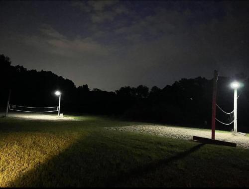 a soccer field at night with two lights at Mustang Sally's Park in South Bend